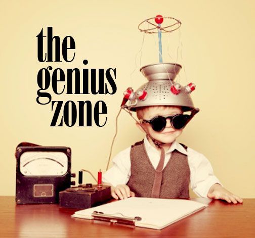 Boy in a colander helmet at a desk under the words "the genius zone"
